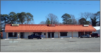 Many aging strip commercial centers
in District II are in need of being redeveloped. Issues 1.svg